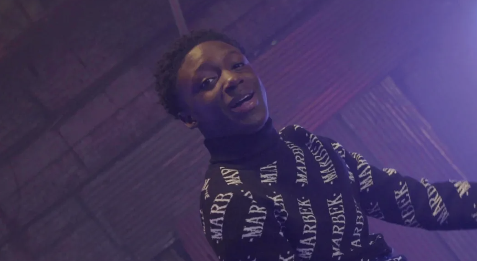 Rising Talent Amos Says "Rock With Me" In Video For Energetic New Tune