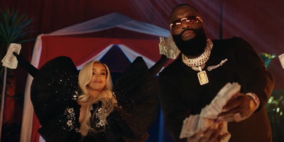 Rick Ross & DreamDoll Connect In Playful Video For 